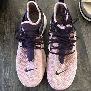 Pink and purple Nike shoes